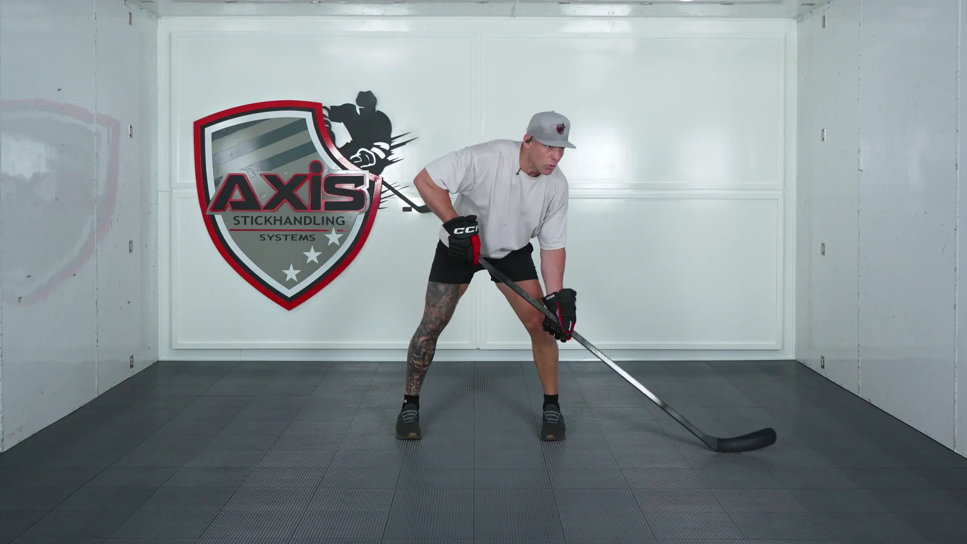A coach in the AXIS training room stickhandling a ball side to side